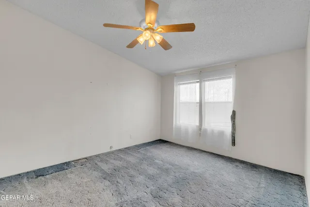 a kitchen with stainless steel appliances a refrigerator sink and white cabinets