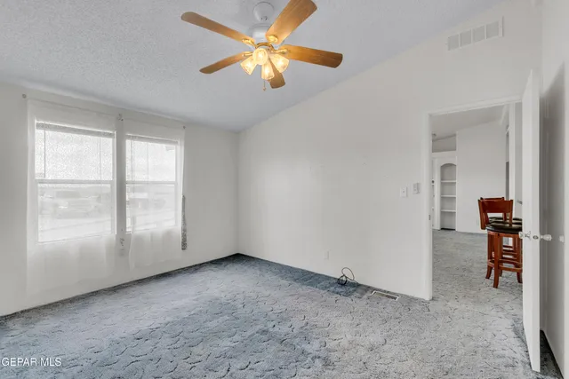a stove top oven sitting inside of a kitchen