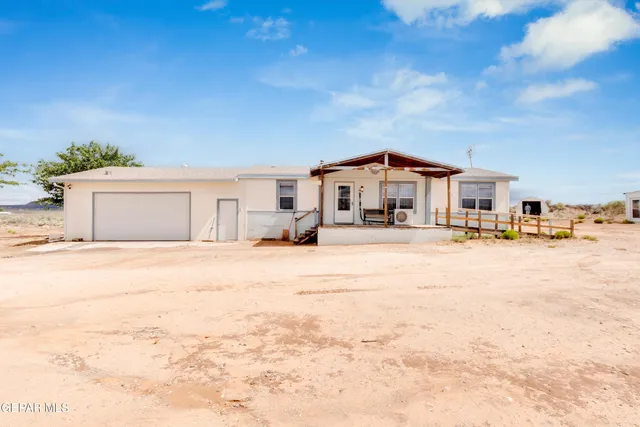 a swimming pool with outdoor seating and yard
