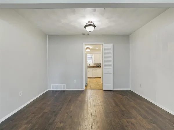 a view of a livingroom with wooden floor