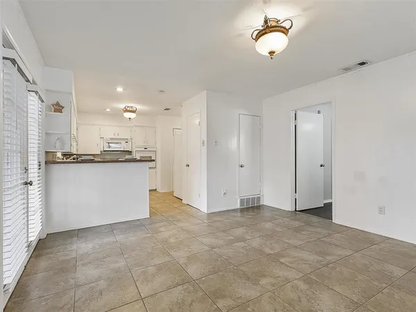 a view of a kitchen with a sink and cabinets