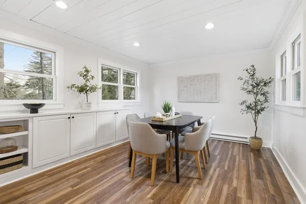 a view of a dining room with furniture and window