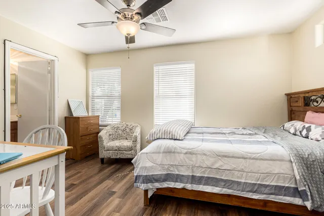 a bedroom with a bed and a couch