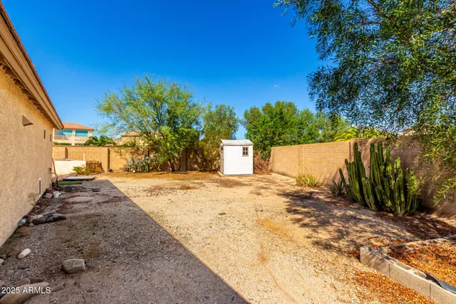 a view of a backyard of the house