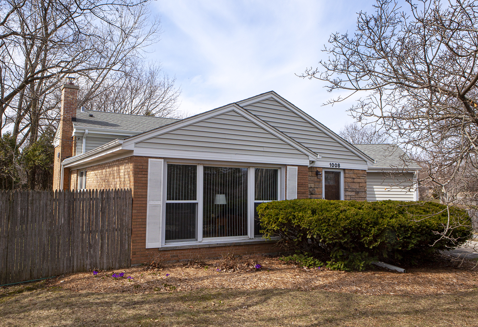 1008 Ridge Road Highland Park, IL 60035 - Photo 1 of 2 a front view of a house with a garden