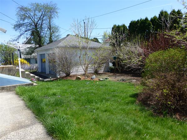 14 Brighton Road Worcester, MA 01606 - Photo 24 of 26 a view of a backyard with table and chairs under an umbrella