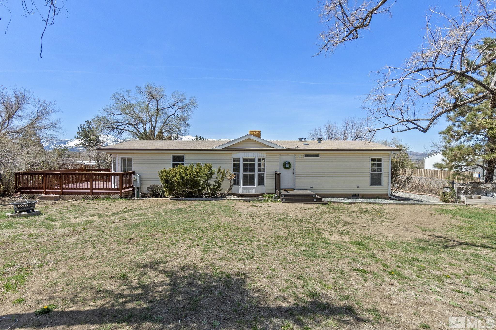 15015 Kivett Lane Reno, NV 89521 - Photo 1 of 37 a view of a house with a yard