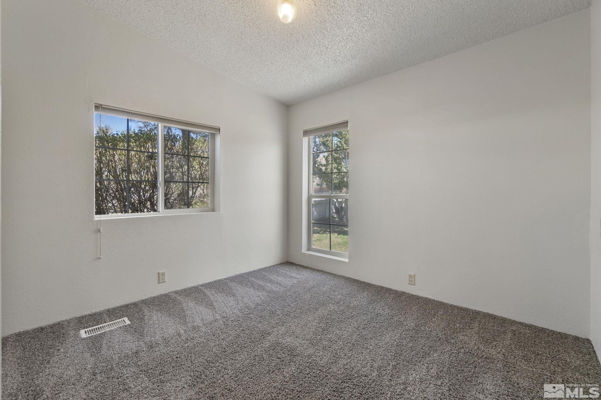 15015 Kivett Lane Reno, NV 89521 - Photo 24 of 37 an empty room with windows