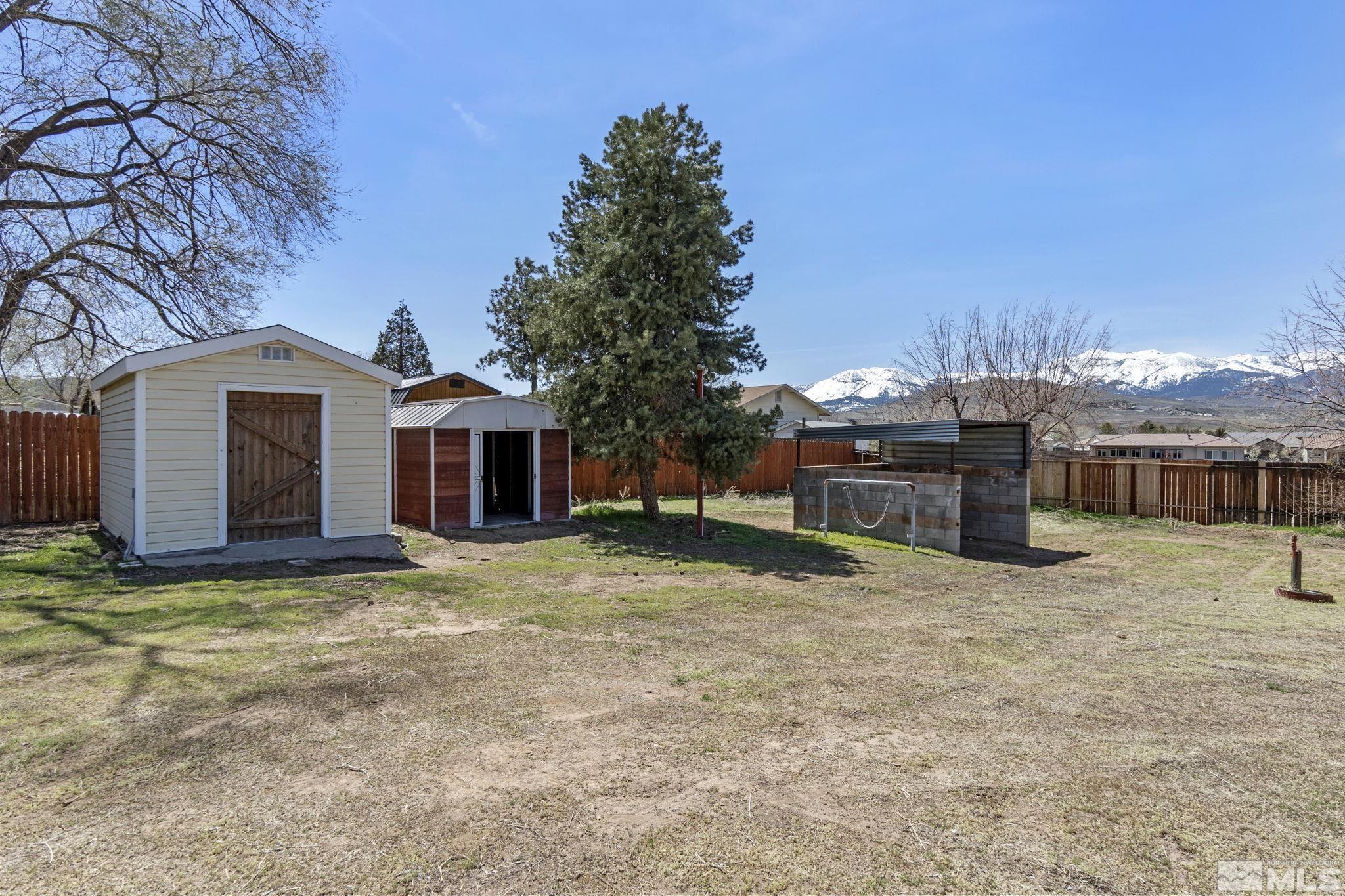 15015 Kivett Lane Reno, NV 89521 - Photo 32 of 37 a view of a house with a yard