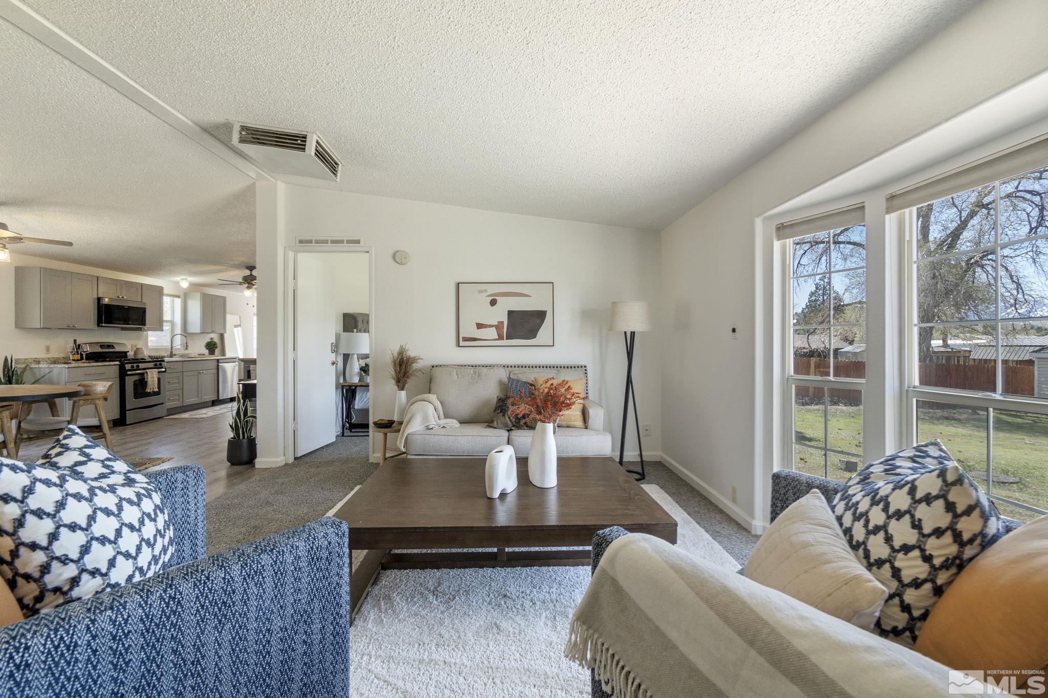 15015 Kivett Lane Reno, NV 89521 - Photo 7 of 37 a living room with furniture and a large window