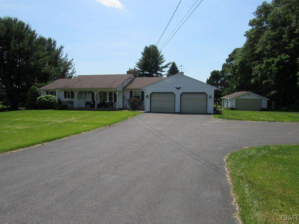 741 South Delps Road Bath, PA 18014 - Photo 1 of 45 a front view of a house with a yard and garage