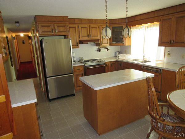 741 South Delps Road Bath, PA 18014 - Photo 13 of 45 a kitchen with a refrigerator a sink a stove and cabinets