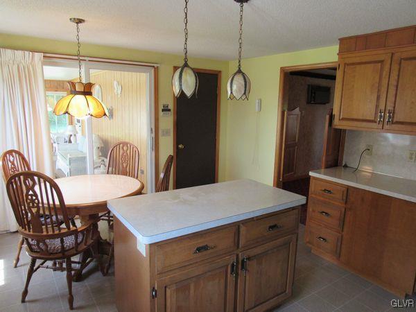 741 South Delps Road Bath, PA 18014 - Photo 15 of 45 a kitchen that has a table chairs and wooden floor