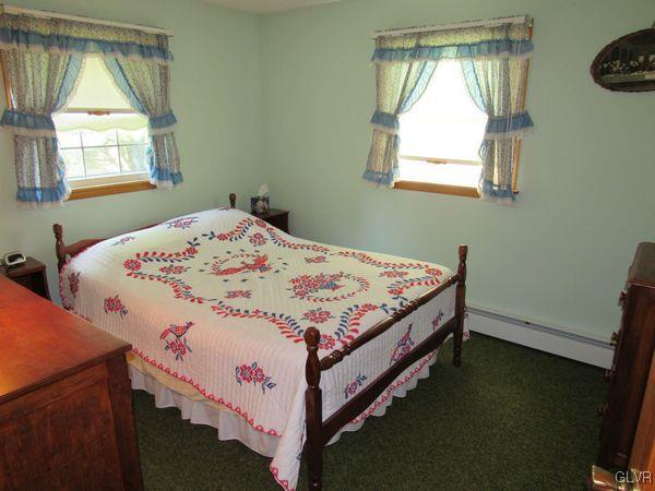 741 South Delps Road Bath, PA 18014 - Photo 23 of 45 a bed sitting in a bedroom next to a window