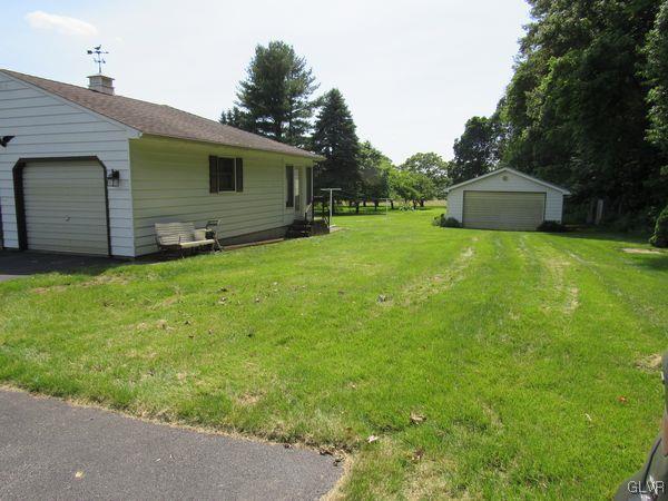 741 South Delps Road Bath, PA 18014 - Photo 42 of 45 a backyard of a house with plants and large tree