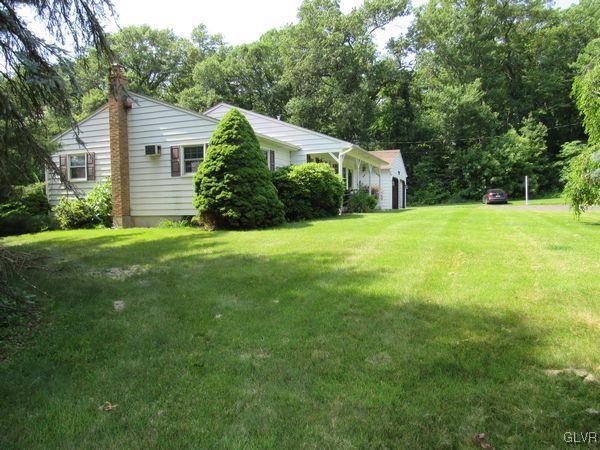 741 South Delps Road Bath, PA 18014 - Photo 7 of 45 a front view of a house with a yard and trees