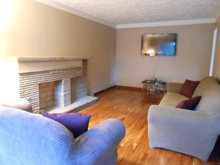 10 Ridge Road Braddock Hills, PA 15221 - Photo 3 of 18 Another view of the formal living room showing the deco fireplace (just add your own electric logs).