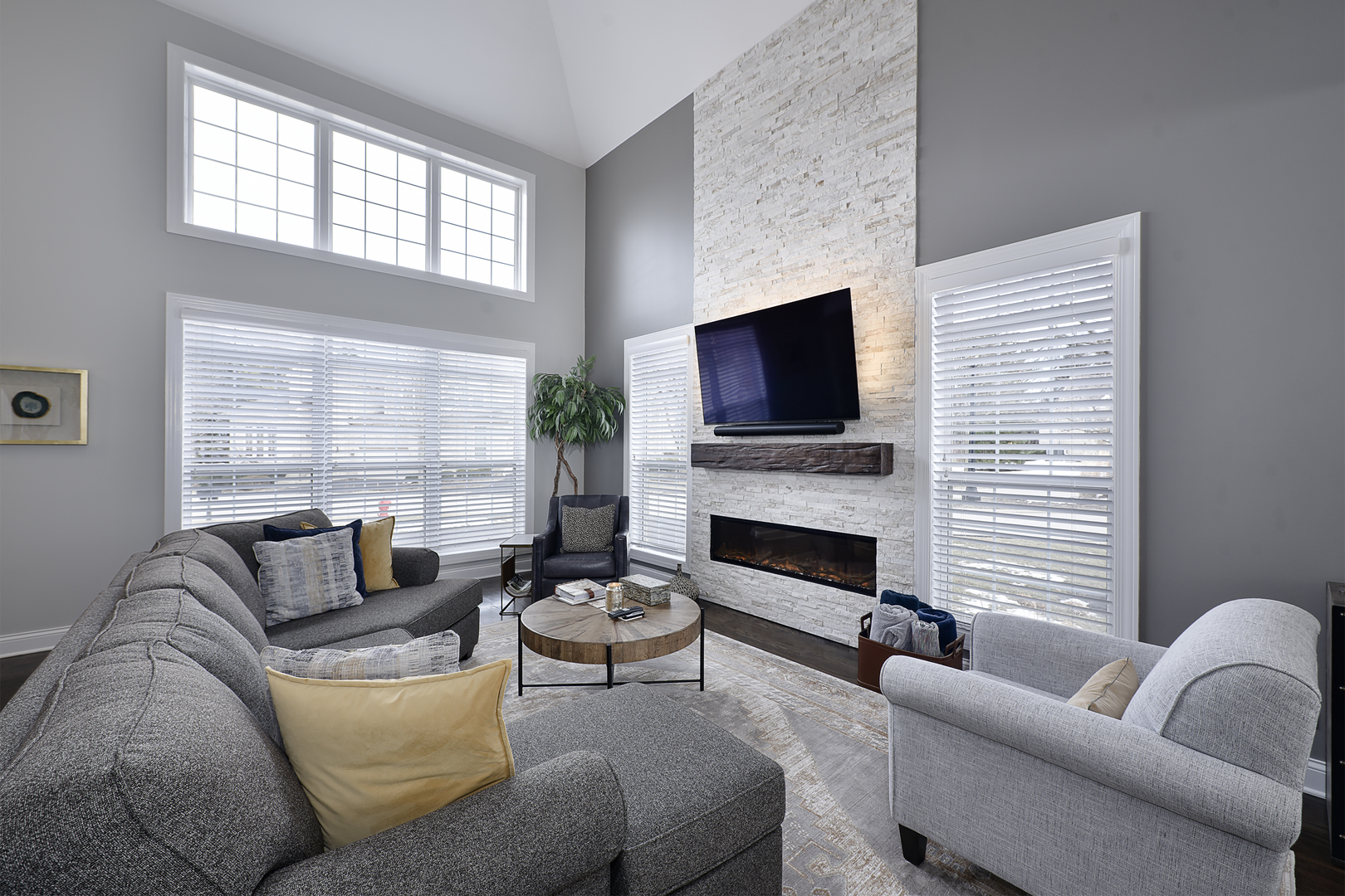 500 Stone Canyon Circle Inverness, IL 60010 - Photo 3 of 33 a living room with furniture a fireplace and a flat screen tv
