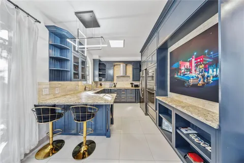 a living room with furniture and flat screen tv