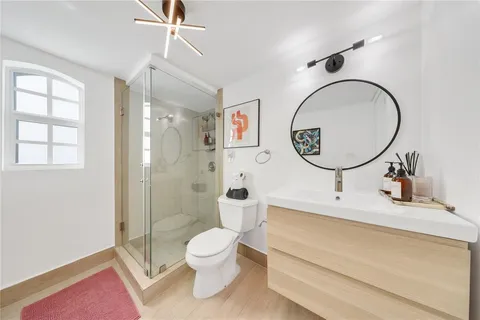 a bedroom with a bed and dresser