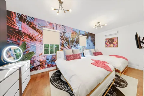 a bed room with a bed and a chair