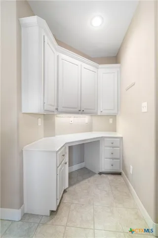 a room with cabinets appliances and cabinets