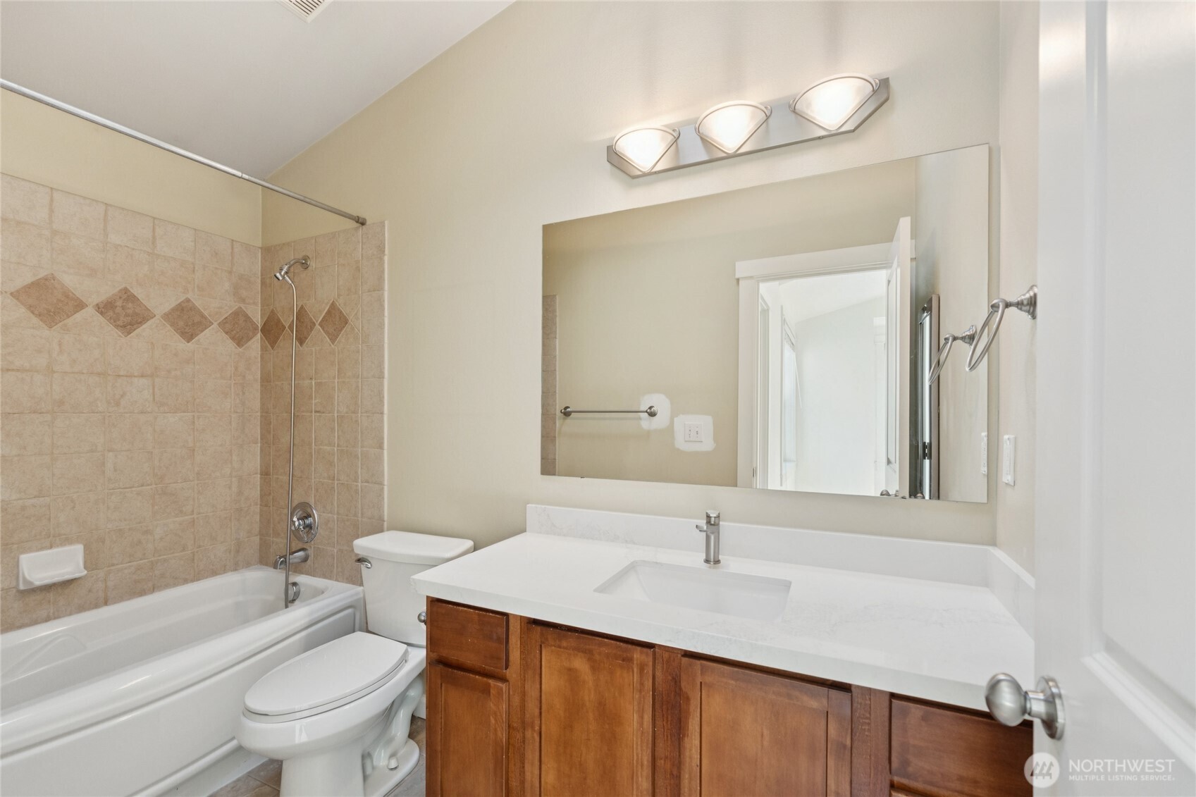 9503 Ashworth Avenue North, Unit B Seattle, WA 98103 - Photo 13 of 26 a bathroom with a granite countertop sink and a mirror