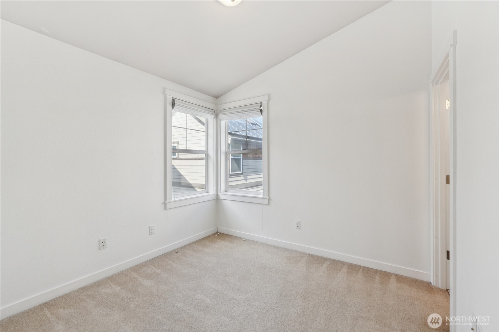 9503 Ashworth Avenue North, Unit B Seattle, WA 98103 - Photo 15 of 26 an empty room with windows