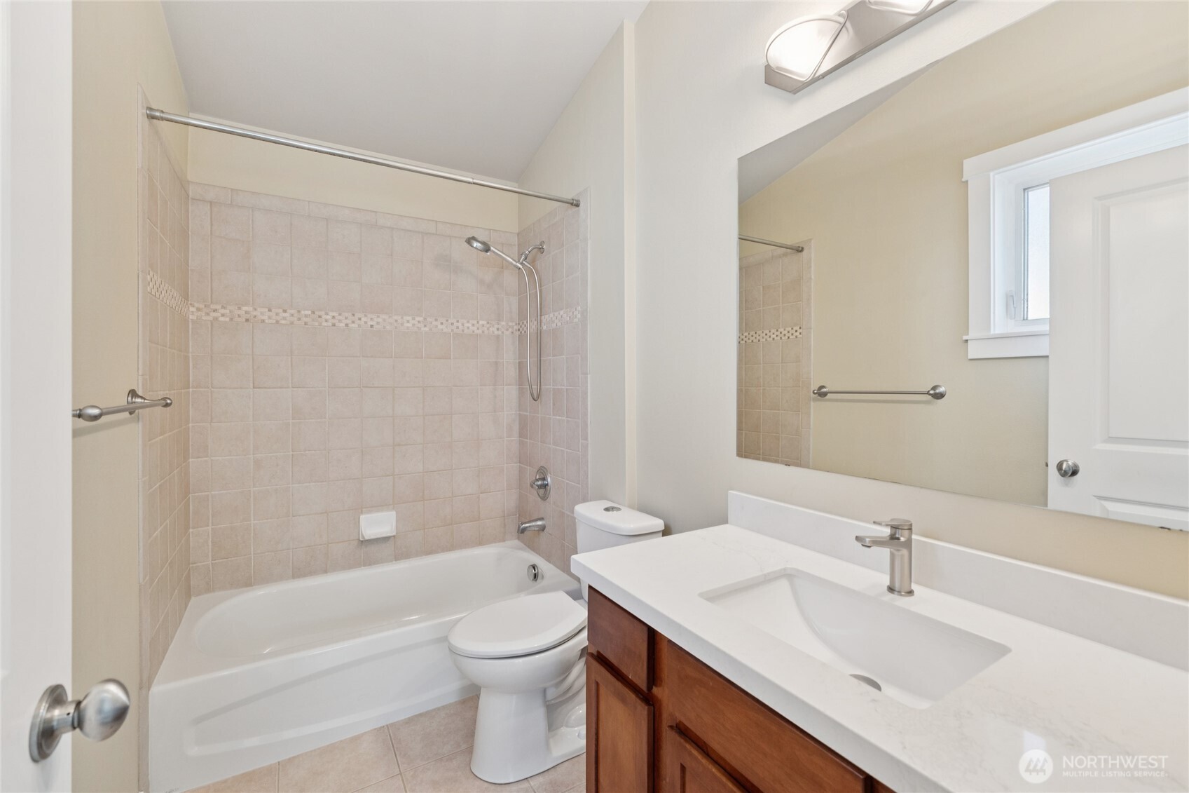 9503 Ashworth Avenue North, Unit B Seattle, WA 98103 - Photo 17 of 26 a bathroom with a sink toilet and shower