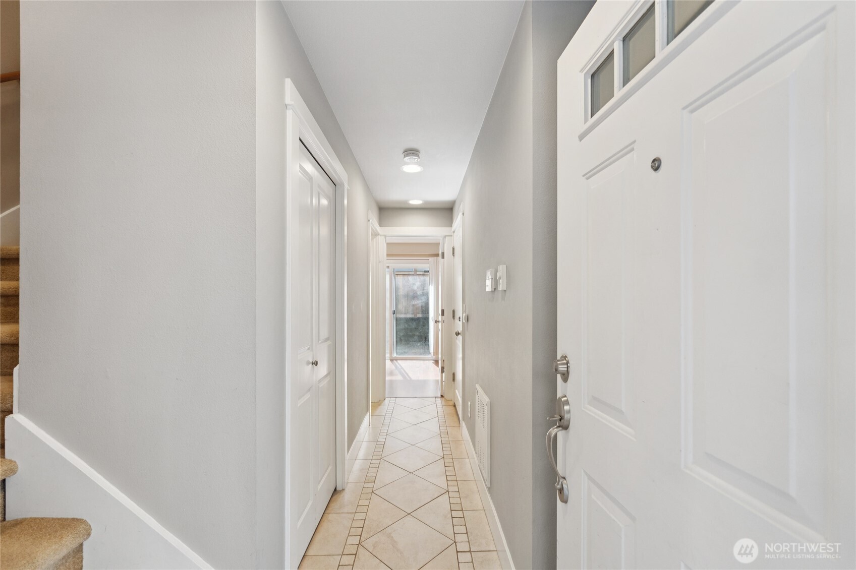 9503 Ashworth Avenue North, Unit B Seattle, WA 98103 - Photo 2 of 26 a view of a hallway with wooden floor and staircase