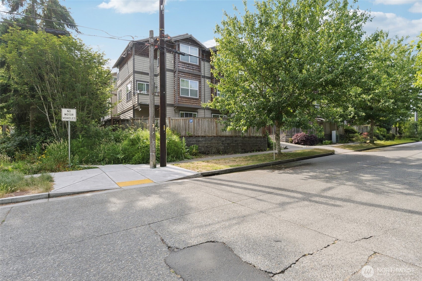 9503 Ashworth Avenue North, Unit B Seattle, WA 98103 - Photo 22 of 26 a front view of a house with a yard