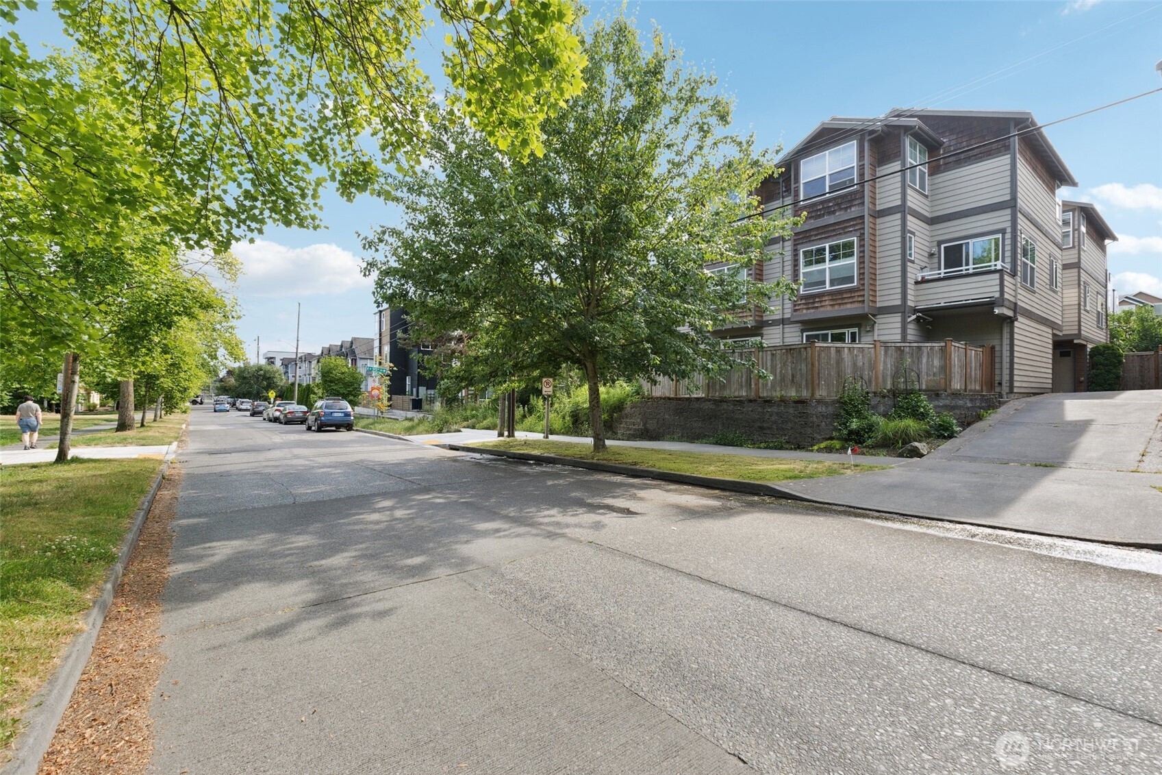 9503 Ashworth Avenue North, Unit B Seattle, WA 98103 - Photo 23 of 26 a view of street with large trees