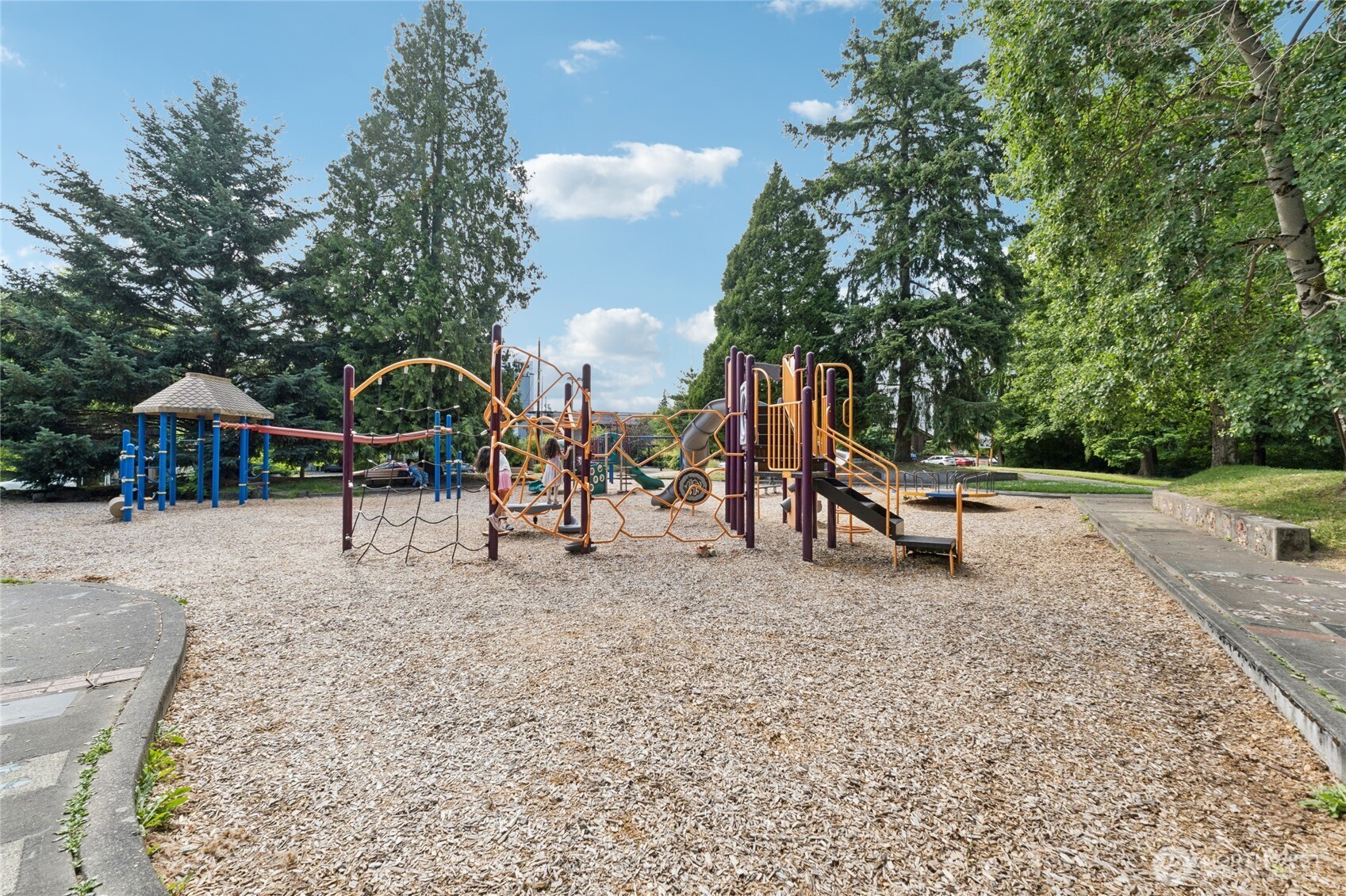 9503 Ashworth Avenue North, Unit B Seattle, WA 98103 - Photo 25 of 26 a view of outdoor space with playground and green space