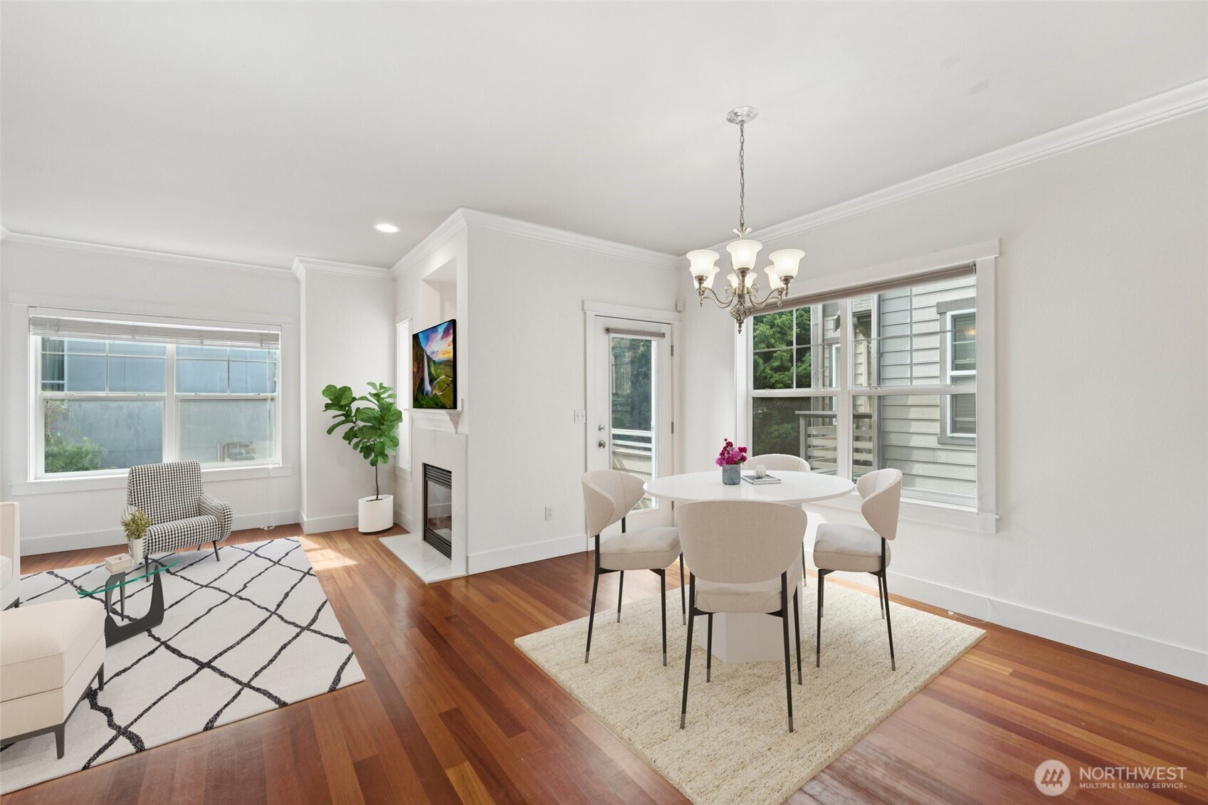 9503 Ashworth Avenue North, Unit B Seattle, WA 98103 - Photo 7 of 26 a view of a dining room with furniture window and wooden floor