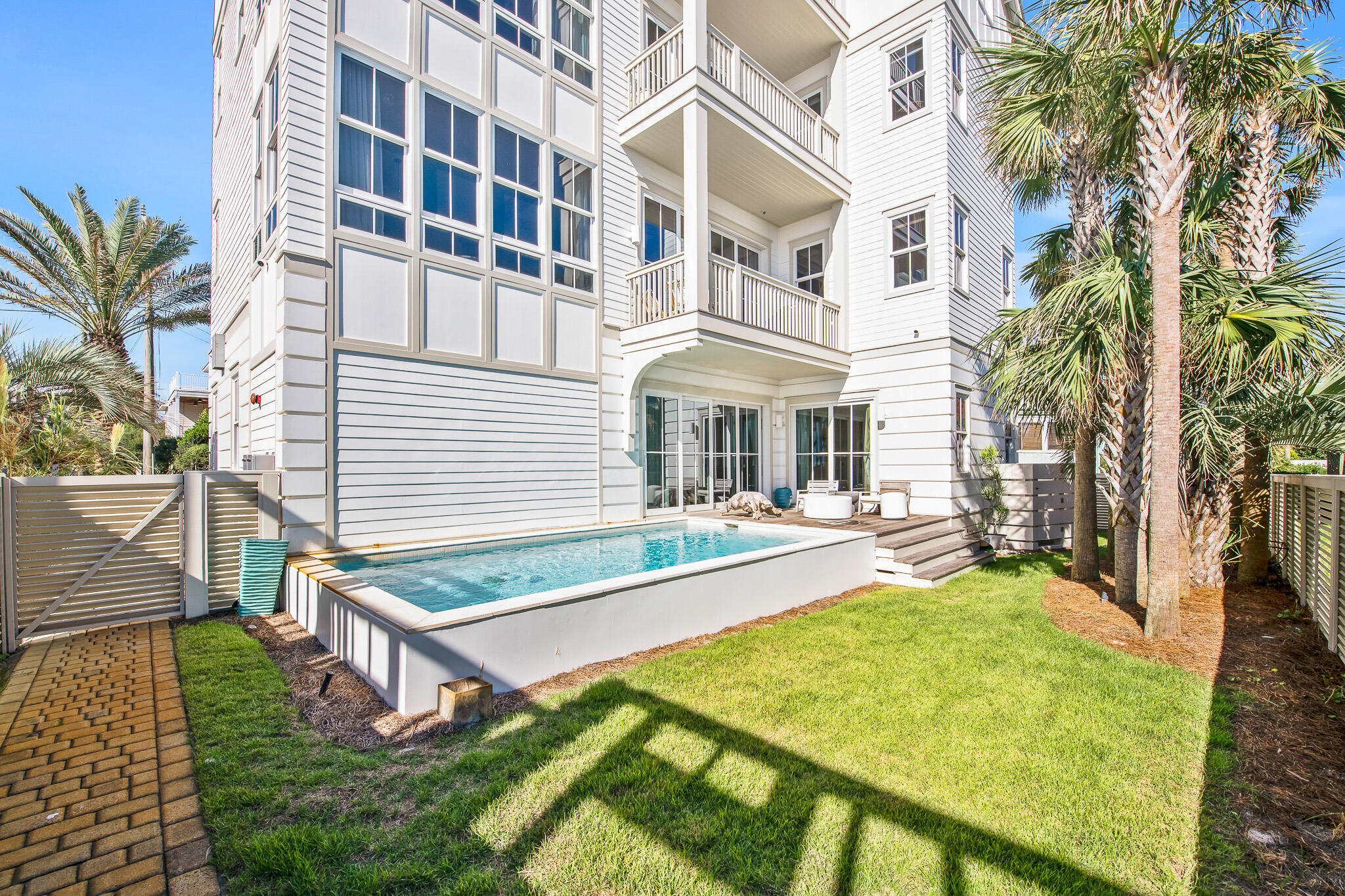 281 Pompano Street Inlet Beach, FL 32461 - Photo 12 of 49 a view of a house with backyard and sitting area
