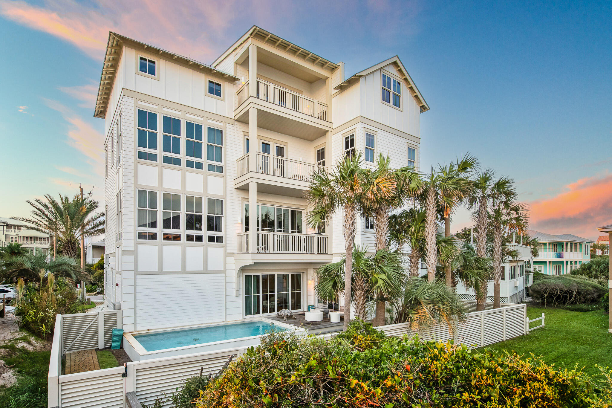 281 Pompano Street Inlet Beach, FL 32461 - Photo 44 of 49 a front view of a residential apartment building with a yard