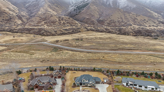 2116 South Valley View Drive, Unit 58 Mapleton, UT 84664 - Photo 7 of 13 Aerial perspective of suburban area with a mountain backdrop