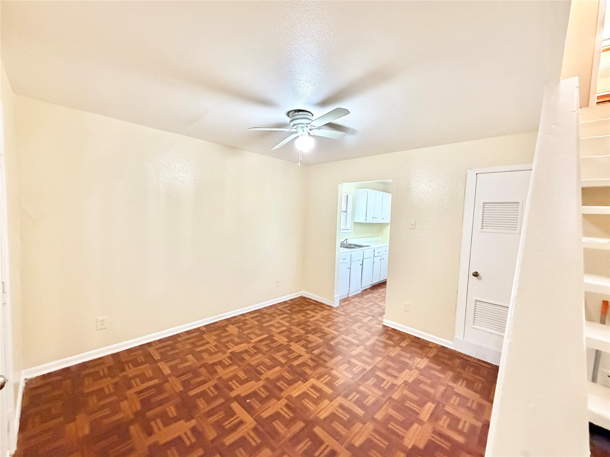 6257 Manor Road, Unit B Austin, TX 78723 - Photo 37 of 38 Living area featuring wood-finish flooring and a ceiling fan