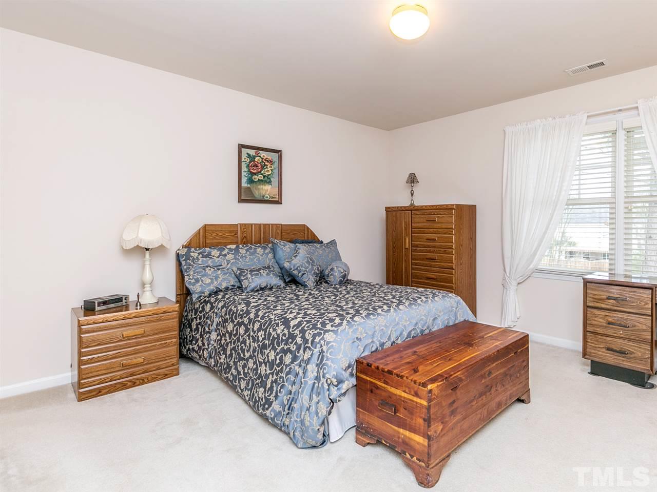 8109 Satillo Lane Raleigh, NC 27616 - Photo 16 of 25 This lovely bedroom has an en-suite bath.