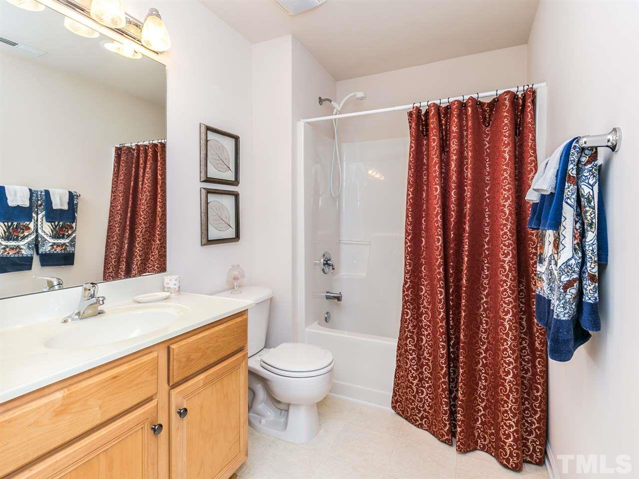 8109 Satillo Lane Raleigh, NC 27616 - Photo 19 of 25 This bath serves bedroom 3 and also has easy access from the loft area. There's also a half bath on the first floor for guests.