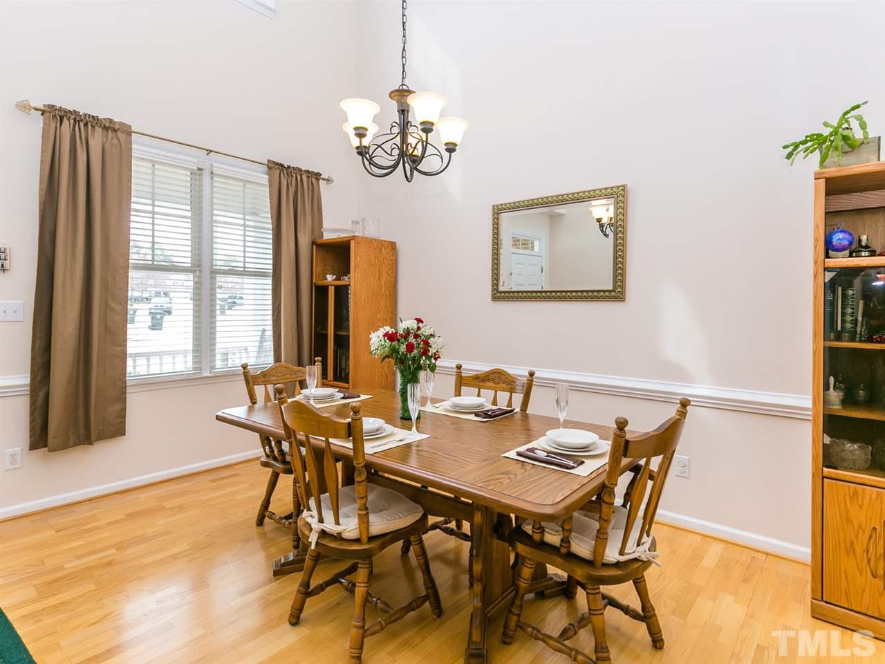8109 Satillo Lane Raleigh, NC 27616 - Photo 3 of 25 Fit for a crowd! Enjoy the volume spaces both up and out in this large dining room!