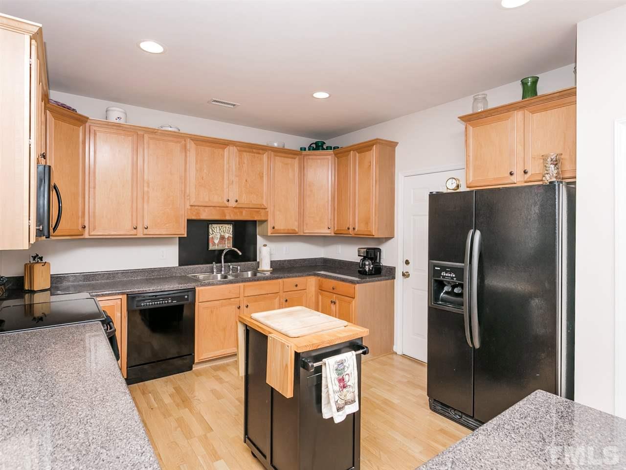 8109 Satillo Lane Raleigh, NC 27616 - Photo 6 of 25 The large refrigerator remains! You should never run out of prep space in this well thought out kitchen.