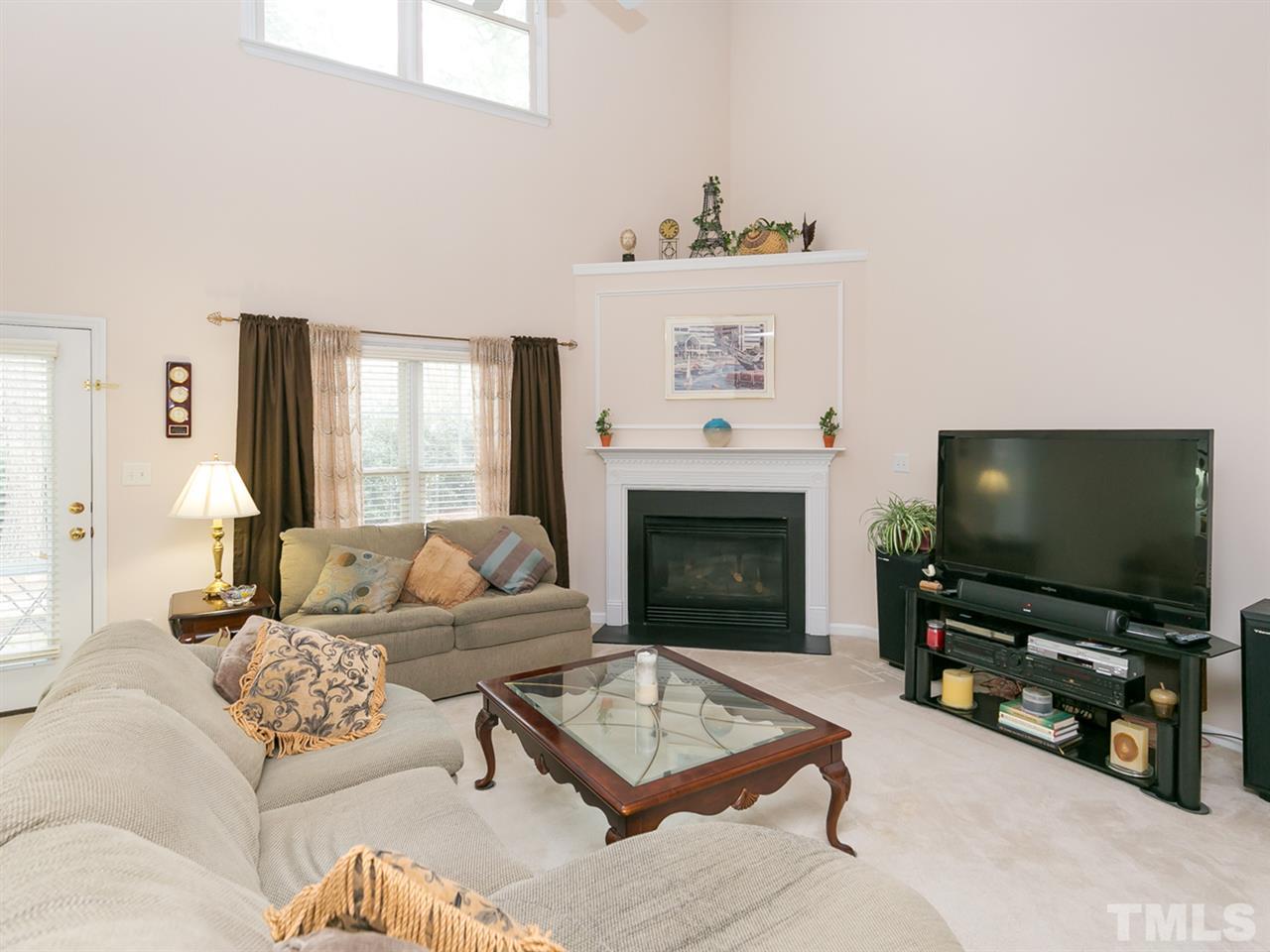 8109 Satillo Lane Raleigh, NC 27616 - Photo 7 of 25 Light pours into this home - with high windows and ceilings the house feels extremely bright and cheerful.