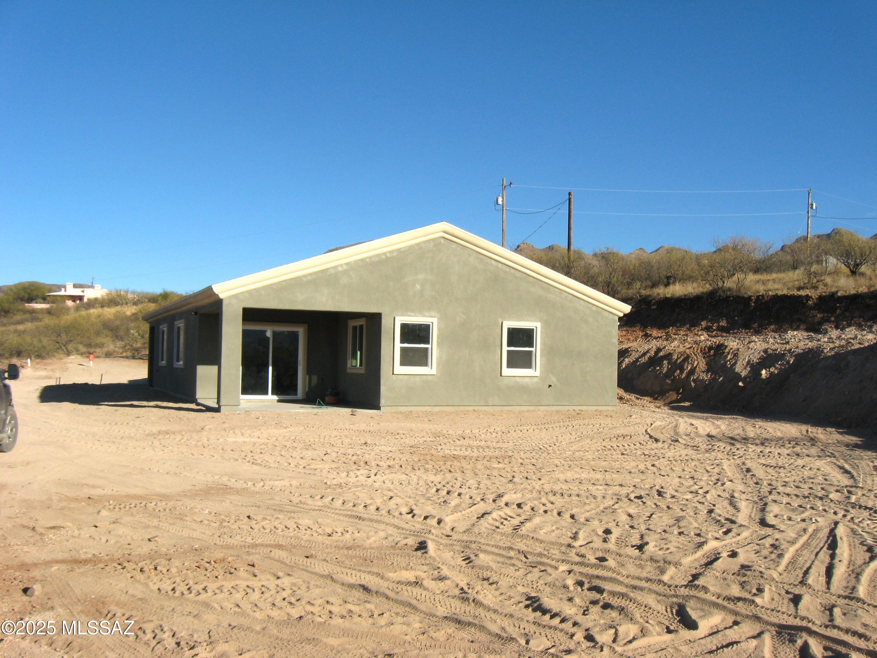 1734 Circulo Badajada Rio Rico, AZ 85648 - Photo 27 of 32 a front view of a house with a yard