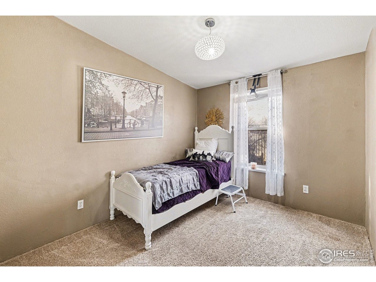 2500 East Harmony Road, Unit 269 Fort Collins, CO 80528 - Photo 12 of 22 a spacious bedroom with a bed and a window