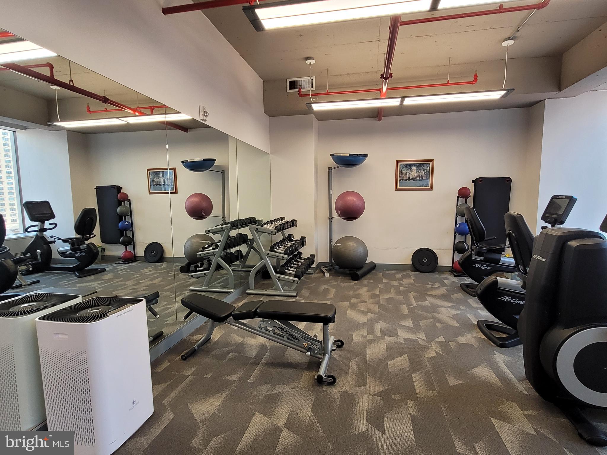 135 South 19th Street, Unit 1007 Philadelphia, PA 19103 - Photo 12 of 13 a view of a room with gym equipment