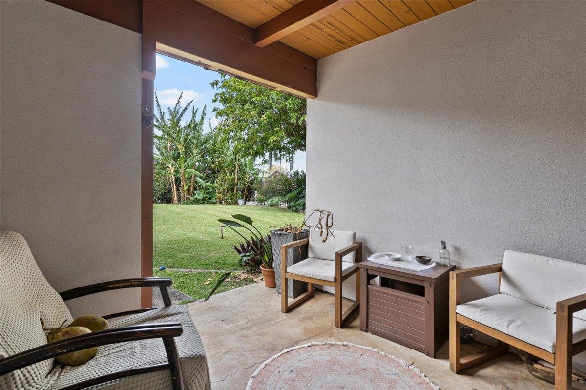 11 Keola Place Makawao, HI 96768 - Photo 18 of 45 a living room with patio furniture and a garden