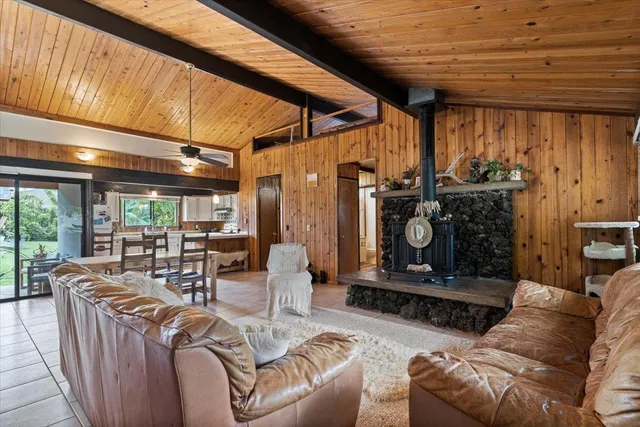 a living room with furniture a fireplace and a table