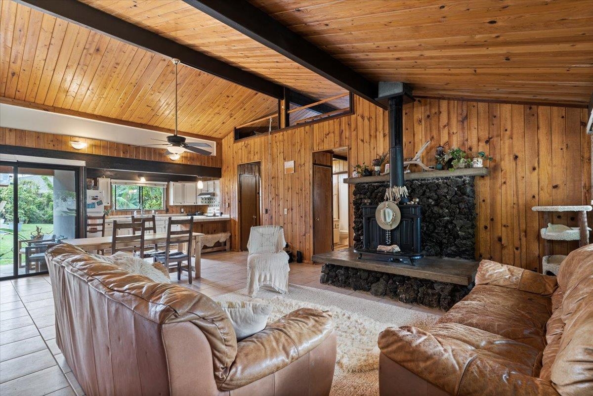 11 Keola Place Makawao, HI 96768 - Photo 3 of 45 a living room with furniture a fireplace and a table