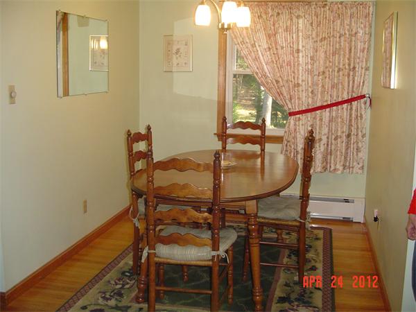 30 Morton Road Freetown, MA 02717 - Photo 3 of 12 a balcony with table and chairs